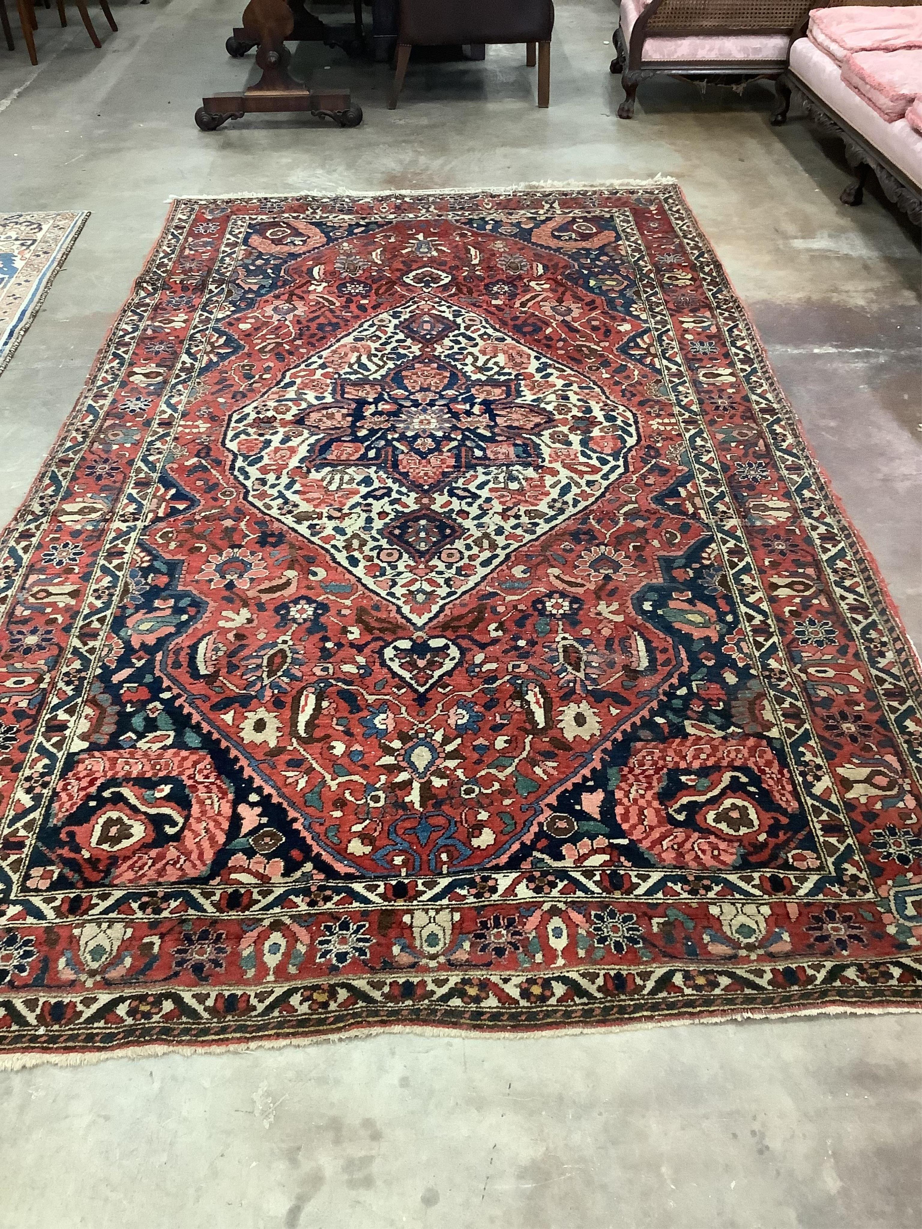 A North West Persian brick red ground carpet, 320 x 178cm. Condition - poor to fair